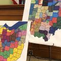 Two maps at a redistricting hearing