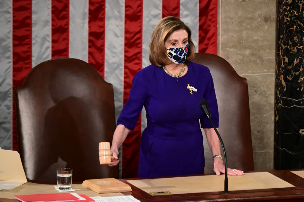 House Speaker Nancy Pelosi, D-Calif., bangs the speaker's gavel during a joint session of Congress to count the Electoral College votes of the 2020 presidential election on Jan. 6, 2021.