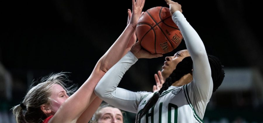 Ohio University’s Cece Hooks, 1, attempts a shot around Ball State University defense in Athens, Ohio, on Wednesday, Feb. 2, 2022. Ball State University went on to win 84-76. [Joseph Scheller | WOUB]