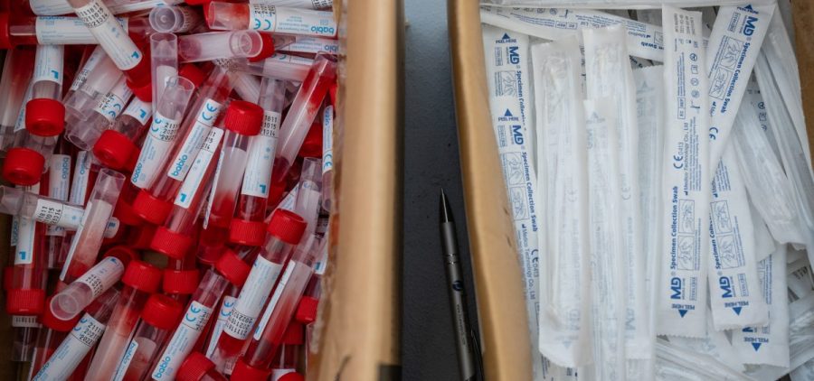 Vials of testing fluid and packages of nose swabs are seen at a drive through COVID-19 testing site at Churchill Downs on January 10, 2022 in Louisville, Kentucky.