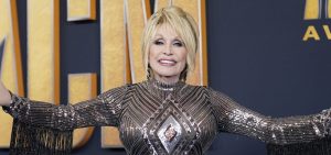 Dolly Parton arrives at the ACM Awards red carpet