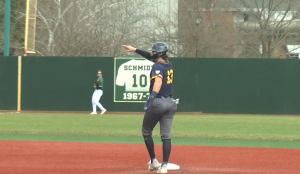 Kent State's Collin Mathews (13) signals for a homerun in the third inning of the front end of a doubleheader between KSU and Ohio on March 19, 2022.