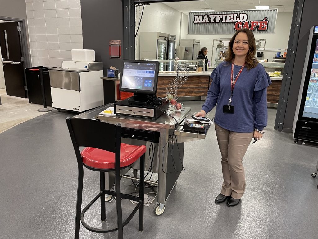 Mayfield Independent School District Food Service Director Leah Feagin stands a the school cafeteria's till