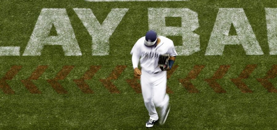 San Diego Padres left fielder Allen Cordoba passes a logo for Play Ball, an initiative from Major League Baseball and USA Baseball, during the fifth inning of a baseball game against the Colorado Rockies in 2017 in San Diego.