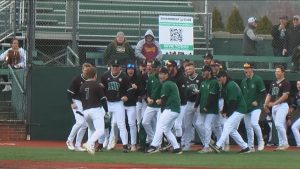 Ohio's AJ Rausch (7) celebrates with his teammates following a go-ahead homerun in the eighth inning of the Bobcats' game against Kent State on March 20, 2022.