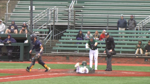 Ohio's AJ Rausch (7) celebrates as Xavier Haendiges (3) dives into home in the seventh inning of the Bobcats' game against Kent State on March 19, 2022.
