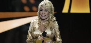 Dolly Parton presents the award for entertainer of the year at the 57th Academy of Country Music Award