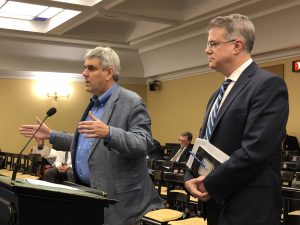 Mapmakers Michael McDonald (left) and Douglas Johnson (right) give a status report to the Ohio Redistricting Commission on March 24, 2022.