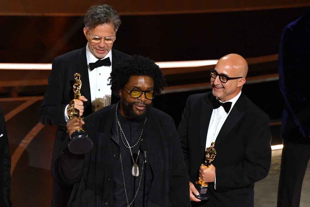 Ahmir "Questlove" Thompson (C), Robert Fyvolent (L) and David Dinerstein (R) accepts the award for for Best documentary feature nominees for "Summer of Soul" onstage during the 94th Oscars at the Dolby Theatre in Hollywood, California