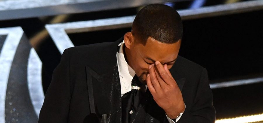 Will Smith accepts the award for best actor in a leading role for "King Richard," minutes after slapping Chris Rock onstage at the Oscars.
