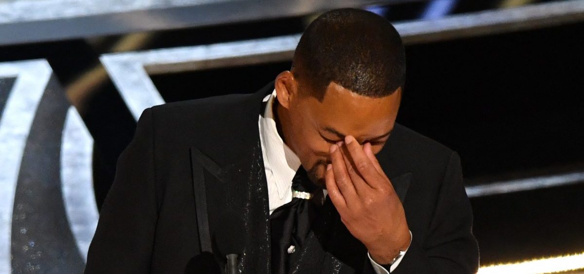 Will Smith accepts the award for best actor in a leading role for "King Richard," minutes after slapping Chris Rock onstage at the Oscars.