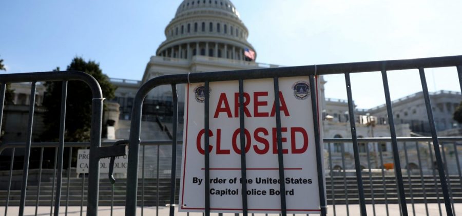 Security has been heightened and fencing was erected around the U.S. Capitol ahead of President Biden's State of the Union address on Tuesday evening.