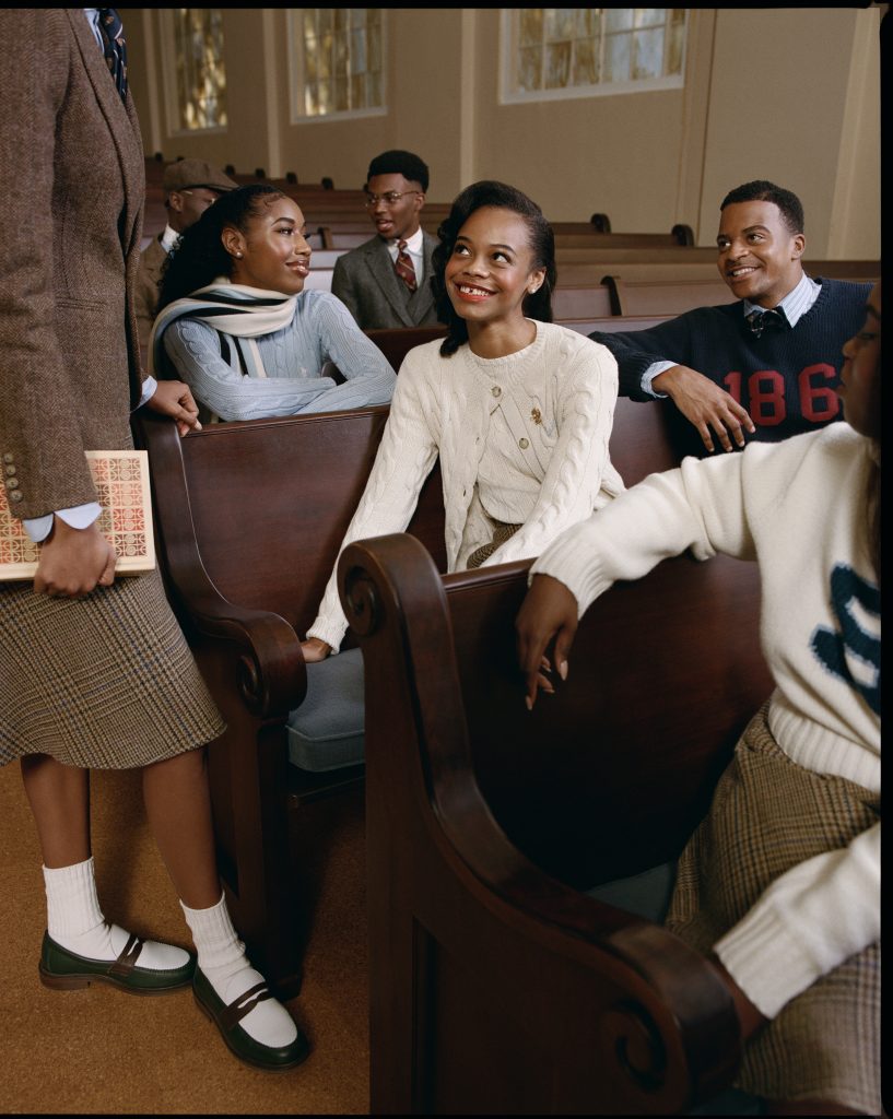 A group of Black people sit in church pews while wearing clothing from the new Ralph Lauren line