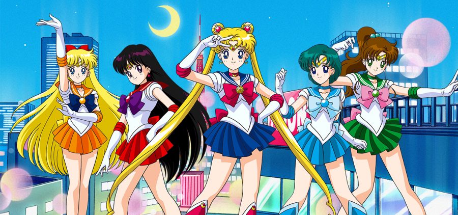 Sailor Moon (center) with Sailor Venus (from left), Sailor Mars, Sailor Mercury and Sailor Jupiter pose on top of a building