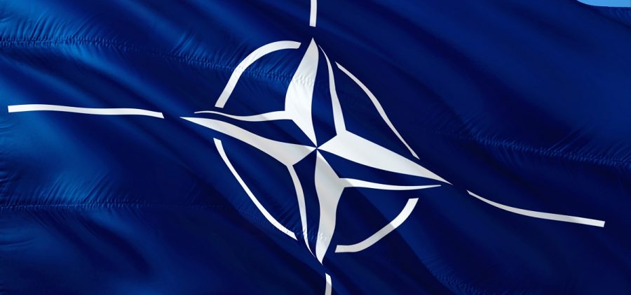 The NATO flag flies in the wind