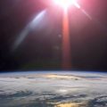 image from space with sun light shining on earth