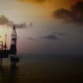 Ocean oil platform at sunset