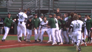 Ohio's Mason Minzey (10) prepares to celebrate with his team as he approaches home plate following a walk-off homerun against Toledo on April 9, 2022.