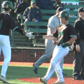 Ohio's Will Sturek (26) gives a high-five to Nick Dolan (1) after Sturek scores a run in the seventh inning of OU's game against Toledo on April 10, 2022.