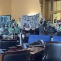 Abortion advocates unfurl a banner and shut down a vote in the Ohio Senate on an abortion bill, September 28, 2021