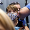 Finn Washburn, 9, receives an injection of the Pfizer-BioNTech COVID-19 vaccine in San Jose, Calif.
