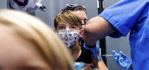 Finn Washburn, 9, receives an injection of the Pfizer-BioNTech COVID-19 vaccine in San Jose, Calif.