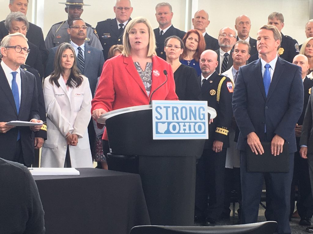 Dayton Mayor Nan Whaley talks about her support for Gov. Mike DeWine's "Strong Ohio" gun reform plan. next to Gov. DeWine at a press conference in Columbus