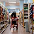 A shopper walks through a grocery store in Washington, D.C