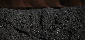 Metallurgical coal sits in a pile after being loaded onto a barge at the SunCoke Energy Partners LP Ceredo Terminal in Ceredo, West Virginia