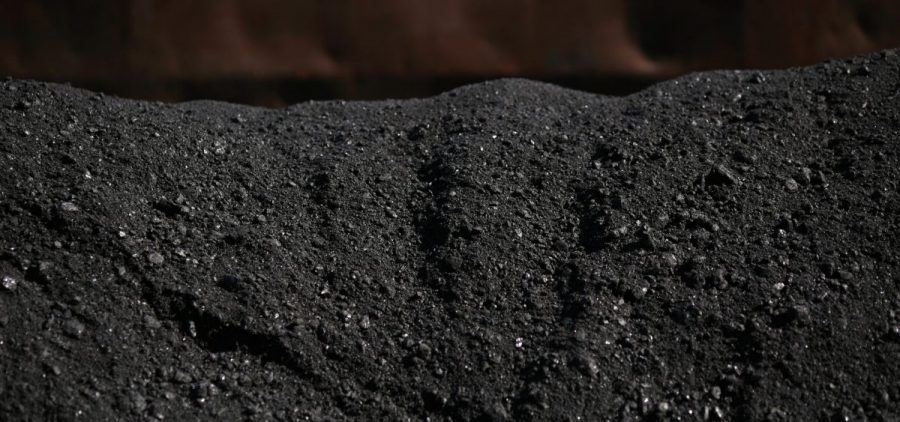 Metallurgical coal sits in a pile after being loaded onto a barge at the SunCoke Energy Partners LP Ceredo Terminal in Ceredo, West Virginia