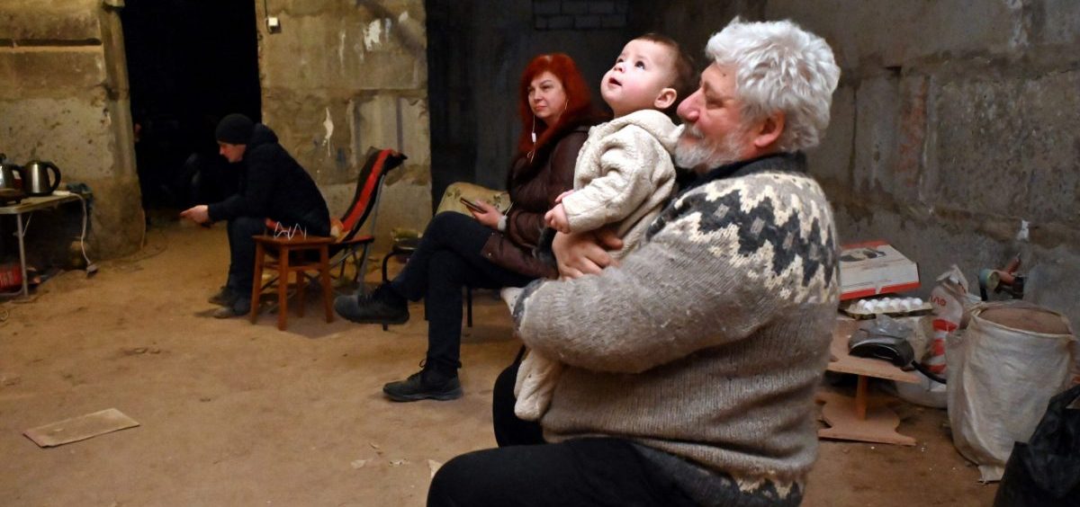 Ukrainians in the eastern city of Kharkiv take shelter in a basement on Sunday.
