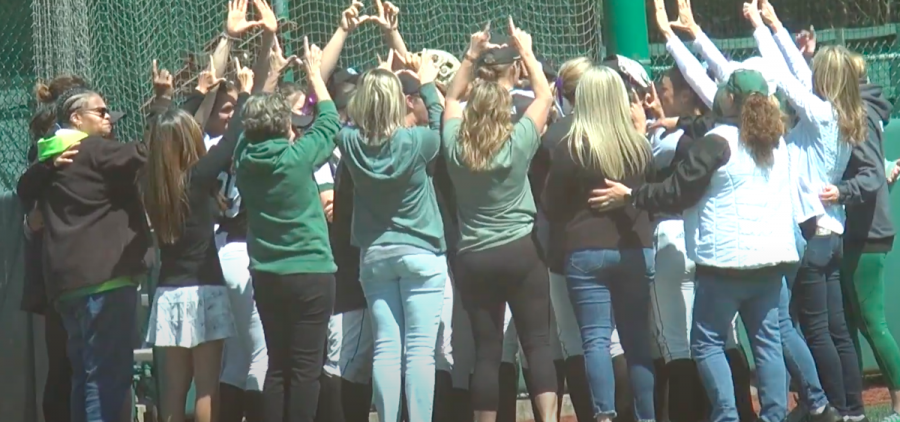 The Ohio Softball team in left field for their pregame huddle surrounded by their mothers for Mother's Day before their game against Western Michigan on May 8, 2022.