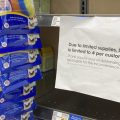 A sign telling consumers of limits on the purchase of baby formula hangs on the edge of an empty shelf for the product in a King Soopers grocery store, Wednesday, in Denver.