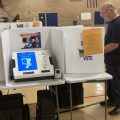 A person casts a vote in Grove City, just south of Columbus.