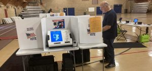 A person casts a vote in Grove City, just south of Columbus.