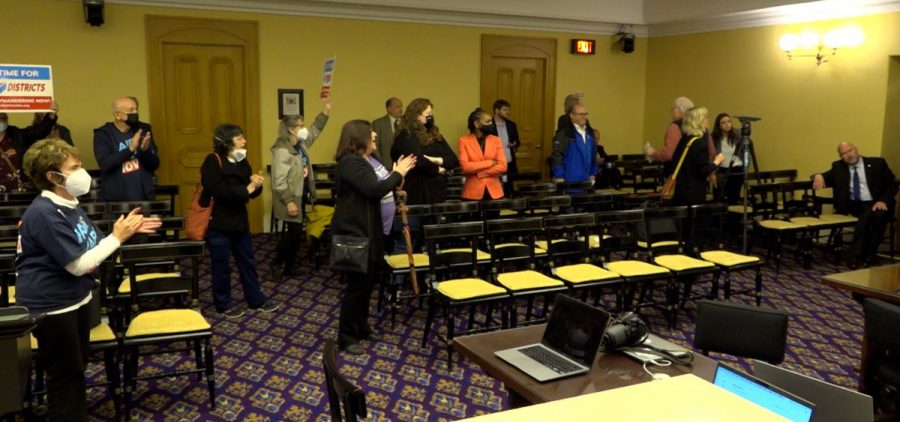 Advocates chant “fair maps now” in a House committee room after the Ohio Redistricting Commission adjourns without making plans for new state legislative district maps.