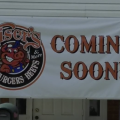 A coming soon sign outside of the new Kaiser's Barbecue location on East State Street