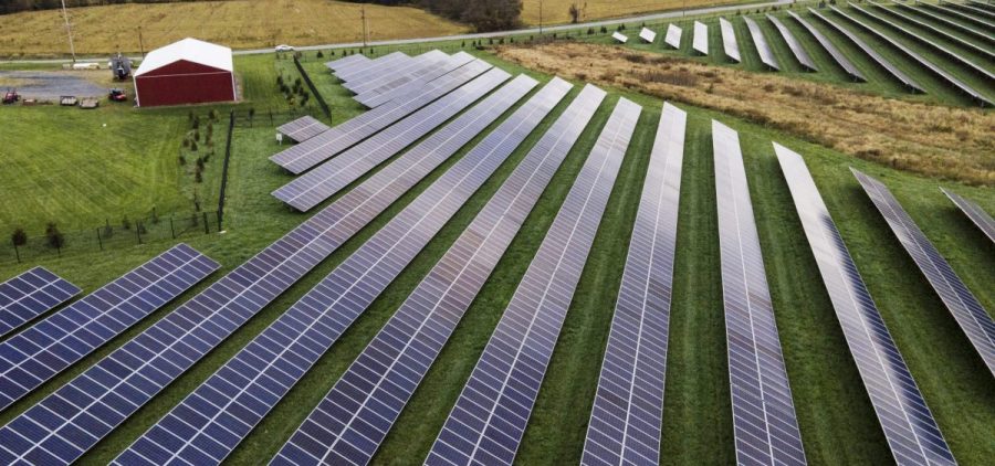Farmland is seen with solar panels from Cypress Creek Renewables, Oct. 28, 2021, in Thurmont, Md.