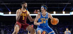 UCLA guard Jaime Jaquez Jr., right, tries to get by Southern California forward Isaiah Mobley during the second half of an NCAA college basketball game