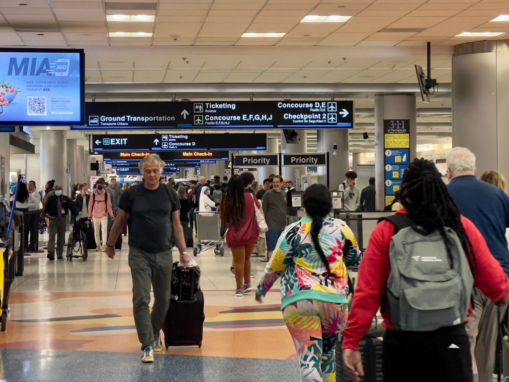 Travelers transit through Miami International Airport in Miami on April 22.