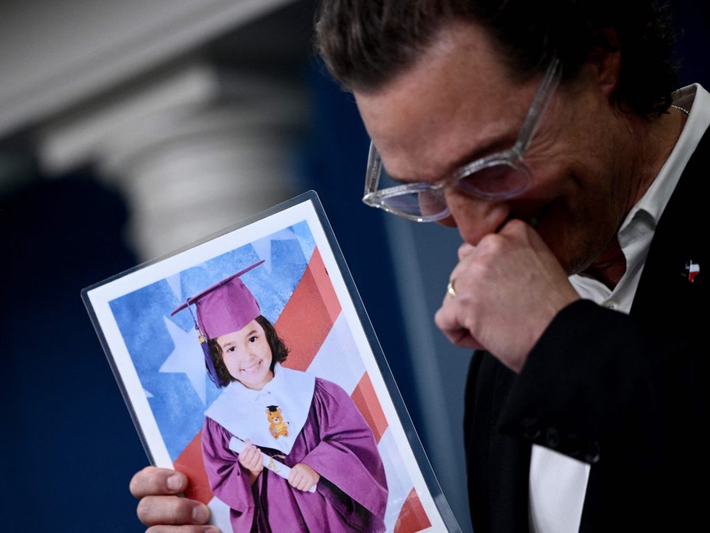 Actor Matthew McConaughey chokes up as he holds a photo of Alithia Ramirez, a 10-year-old student who was killed in the mass shooting at Robb Elementary School in his native Uvalde, Texas