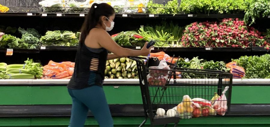 A customer shops at a grocery store in San Rafael, Calif., on June 8.