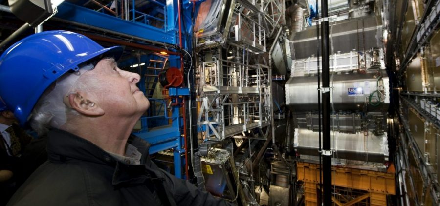Dr. Peter Higgs looks on at the Large Hadron Collider