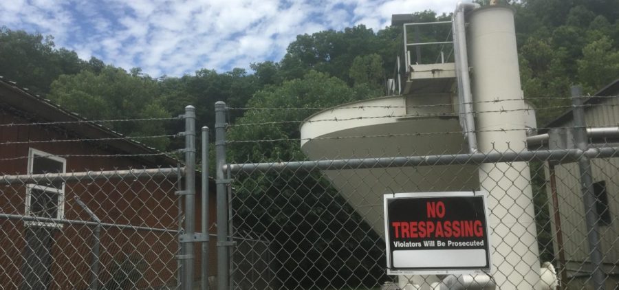 Blackey’s now-defunct water plant behind fence. The fence has a no trespassing sign on it.