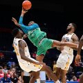 Ohio 1804's Teyvion Kirk goes up against defenders and attacks the rim during The Basketball Tournament at University of Dayton Arena