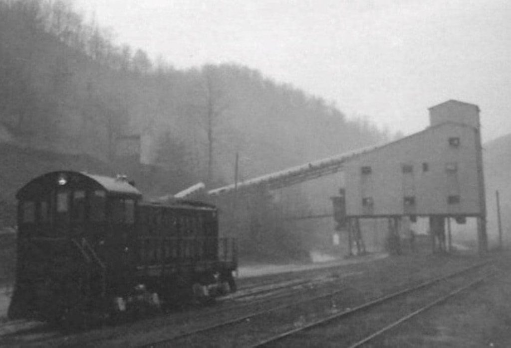 a black and white photo of An old Carbon Glow coal tipple near Blackey