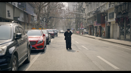Old Man on Deserted Street in Wuhan during COVID