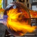 intense flame meltiing glass into shape of a bowl
