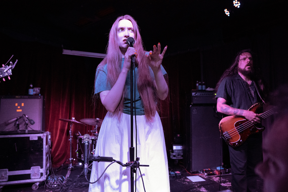 Dry Cleaning performs on stage at Ace of Cups in Columbus, OH. Pictured from left to right: vocalist Florence Shaw, guitarist Lewis Meynard. 