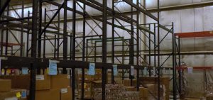 Shelves at the Southeast Ohio Foodbanks warehouse in Logan are almost entirely empty